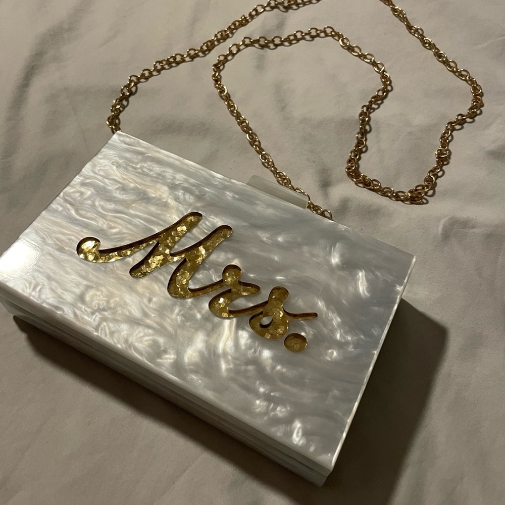 Hard rectangular “Mrs” purse